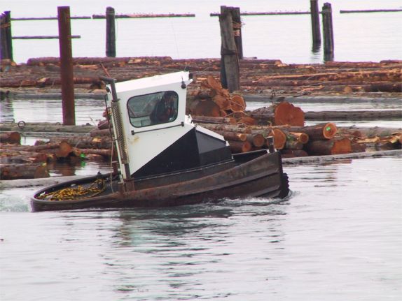 A log-yard tug at work.